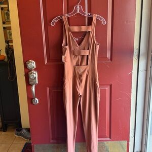 Free people never better Jumpsuit
NWT 
Choc color